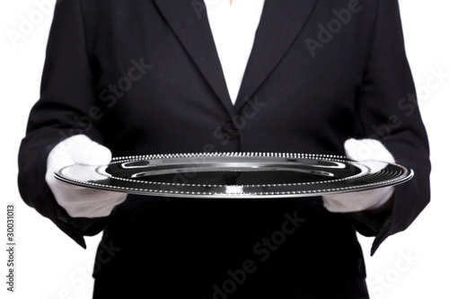 Female butler holding a silver tray isolated on white. photo