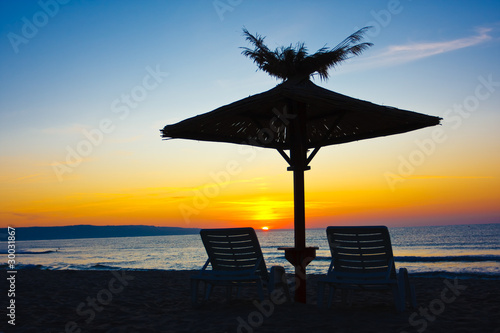 view of chairs and umbrellas on the beach photo