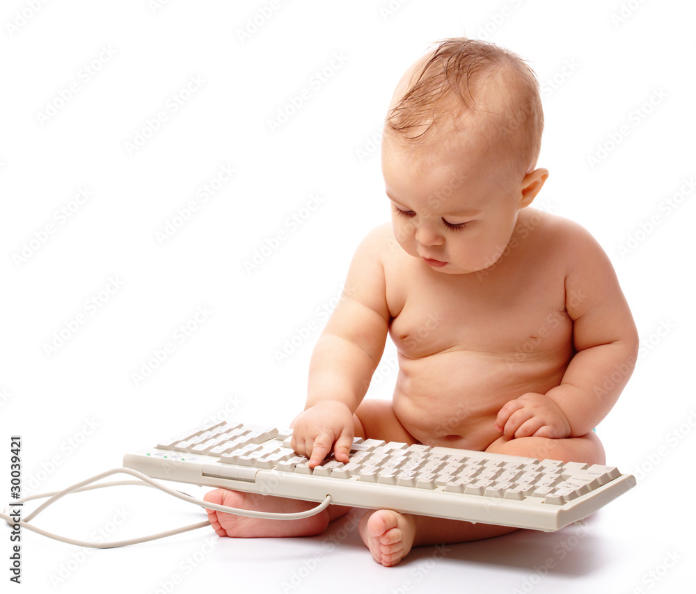 Little child is typing on keyboard Little child is typing on keyboard