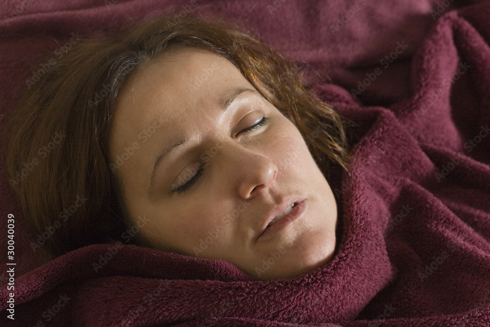 Closeup of woman sleeping on couch Closeup of woman sleeping on couch