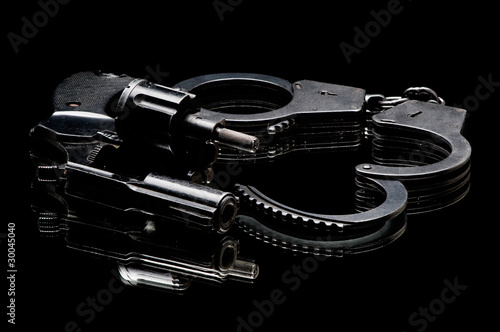 Billede på lærred pistol with handcuffs