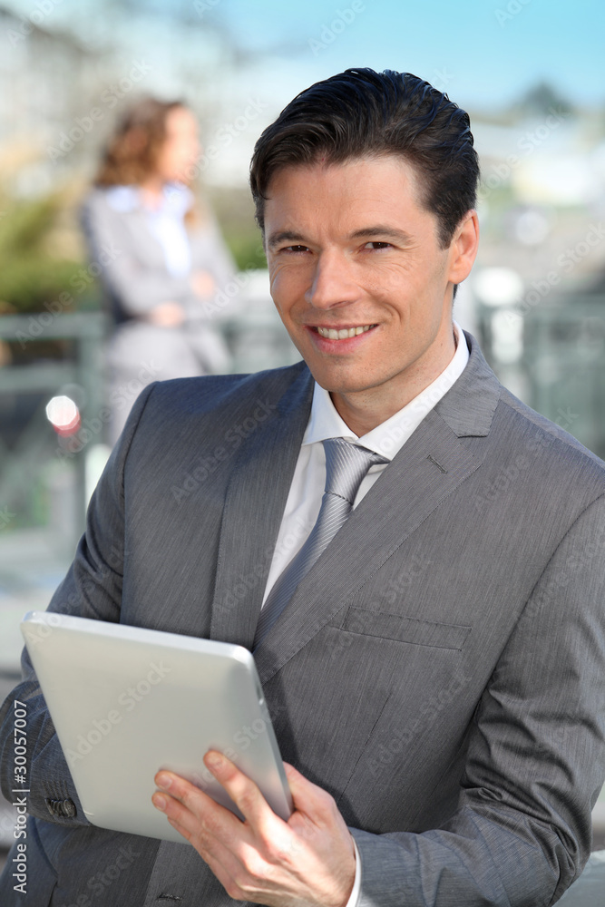 Portrait of businessman working on electronic tablet Portrait of businessman working on electronic tablet