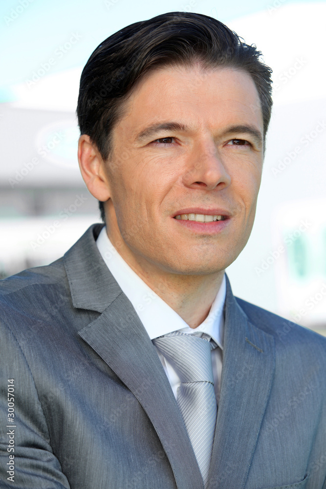 Portrait of businessman standing outside the office Portrait of businessman standing outside the office