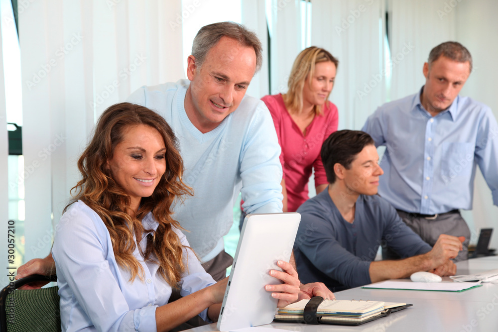 Office workers in a training course Office workers in a training course