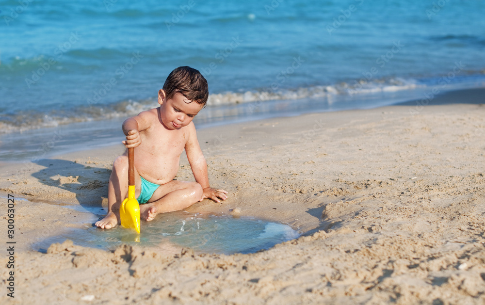 Child playing on the beach Child playing on the beach