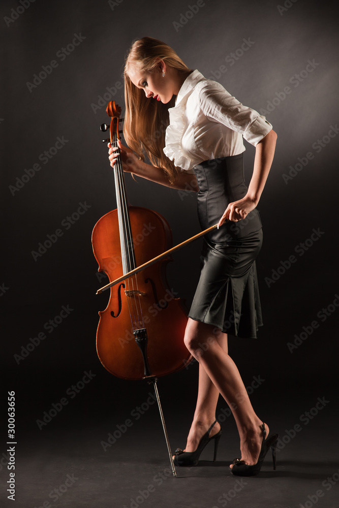 Elegant girl playing with passion on bass-viol Elegant girl playing with passion on bass-viol