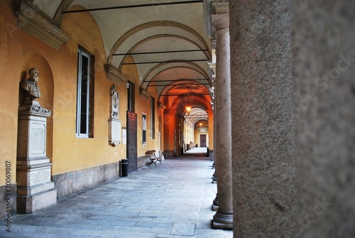 Courtyard and arcade in famous Pavia university, Lombardy, Italy © Crisferra