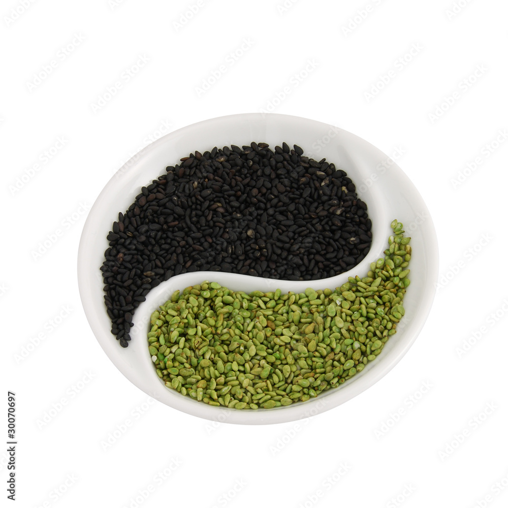 Flavored sesame seeds in small yin yang shape plate Flavored sesame seeds in small yin yang shape plate