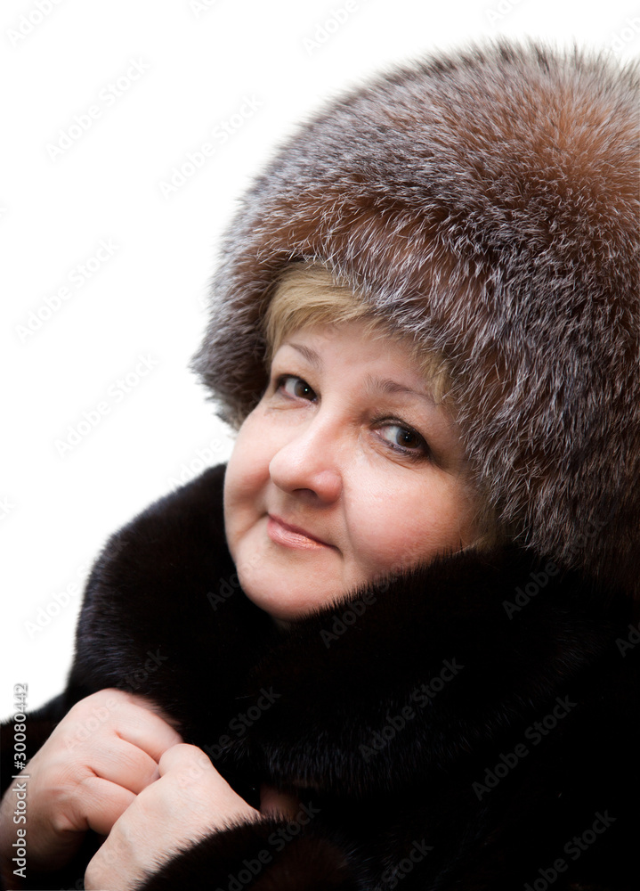 Beautiful woman wearing in fur hat and in fur coat Beautiful woman wearing in fur hat and in fur coat