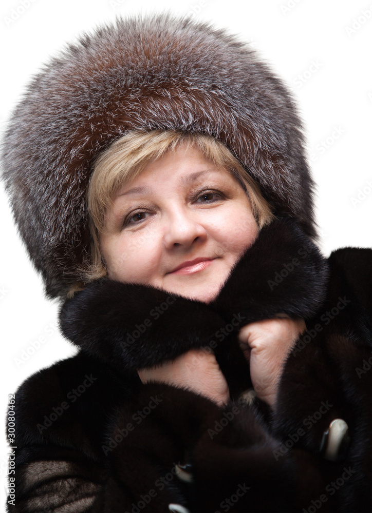 Beautiful woman wearing in fur hat and in fur coat Beautiful woman wearing in fur hat and in fur coat