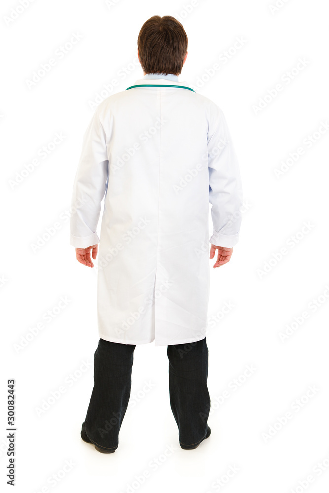 Medical doctor standing back to camera isolated on white. Medical doctor standing back to camera isolated on white.