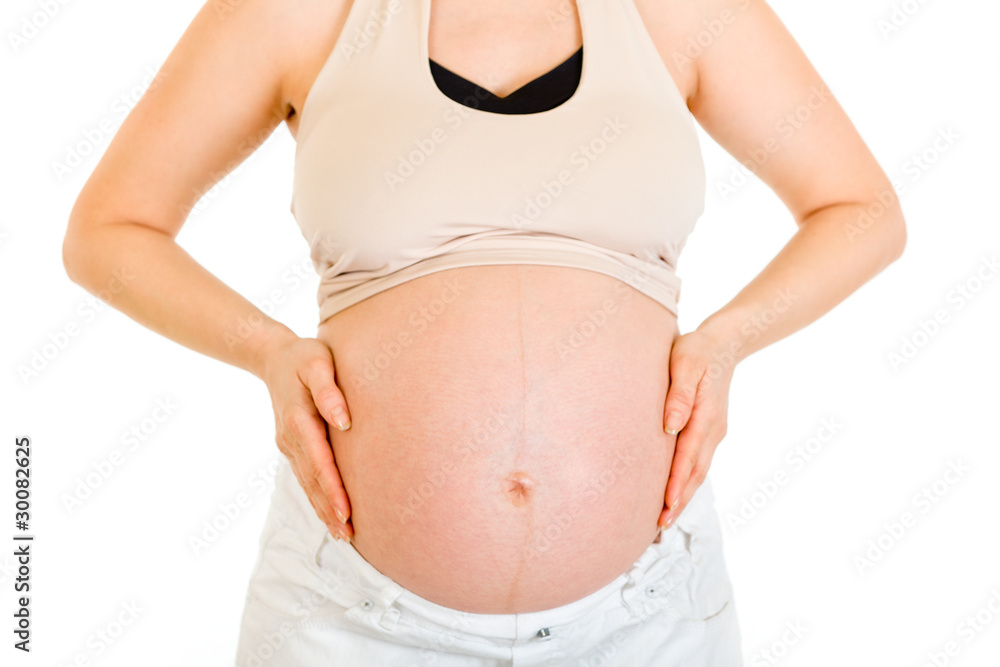 Pregnant woman holding her belly isolated on white. Close-up.. Pregnant woman holding her belly isolated on white. Close-up..