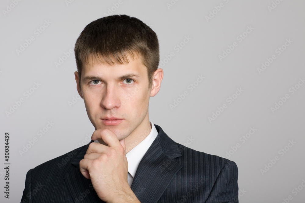 Pensive handsome young businessman Pensive handsome young businessman