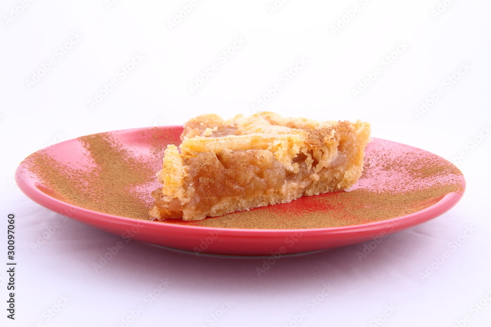 Apple Pie - a slice on a plate decorated with cinnamon Apple Pie - a slice on a plate decorated with cinnamon