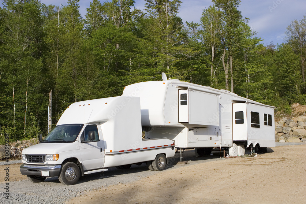 Fifth wheel trailer parked at a campground