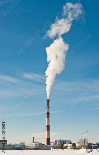 Smokestack over blue sky. Climate warming concept