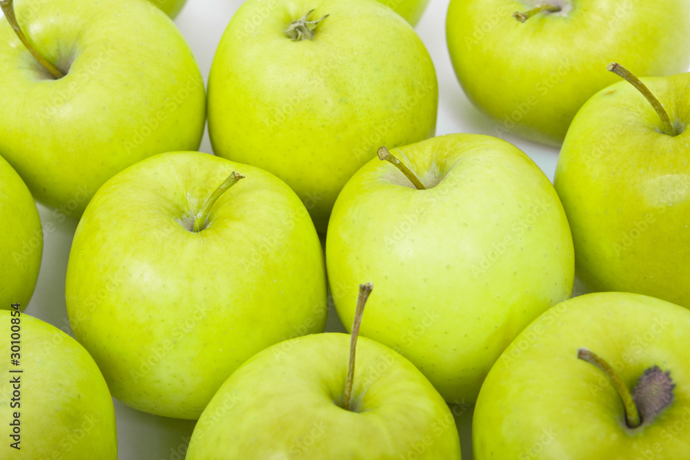 Green and yellow apples on a white baclground Green and yellow apples on a white baclground