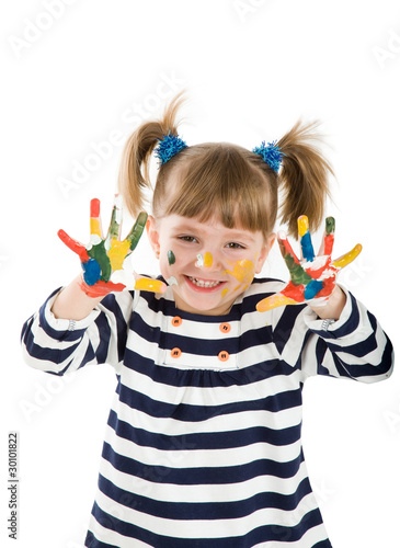 girl with hands soiled in a paint.