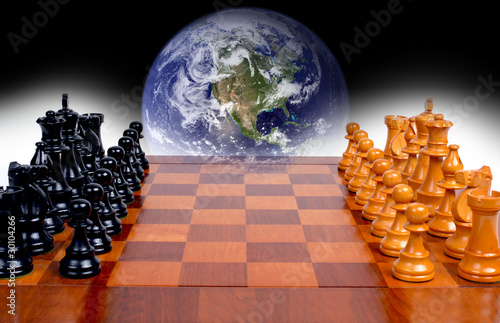 globe from space hanging over a chess board