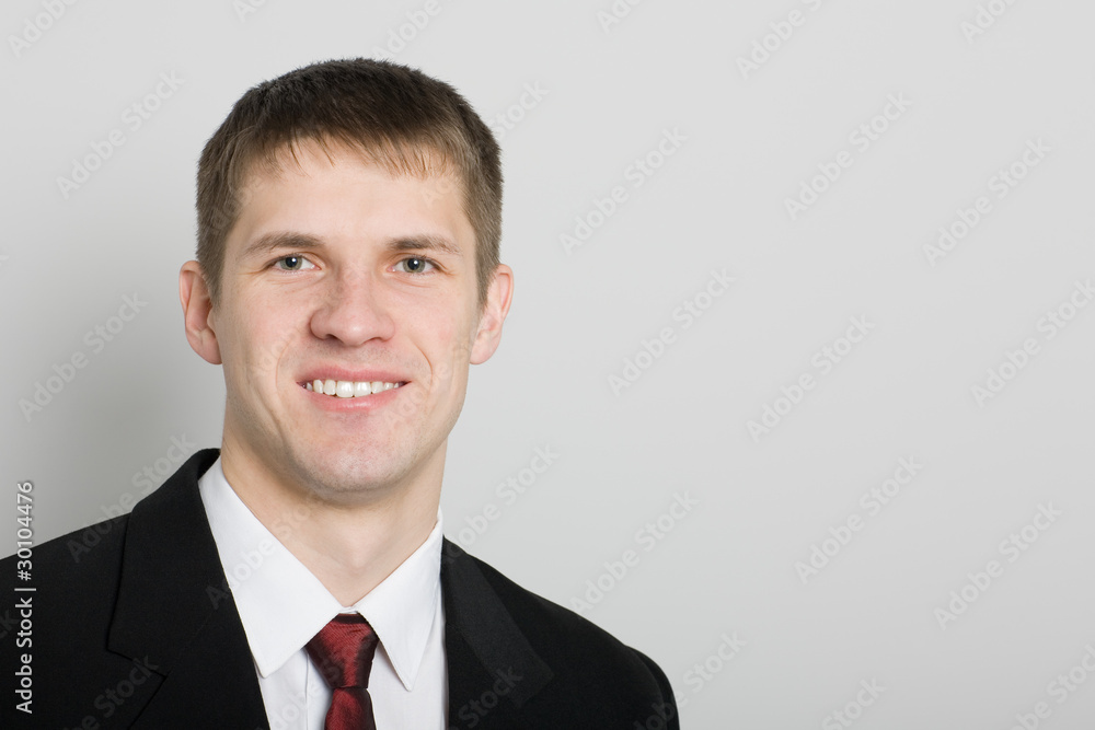 Handsome smiling young businessman. Handsome smiling young businessman.