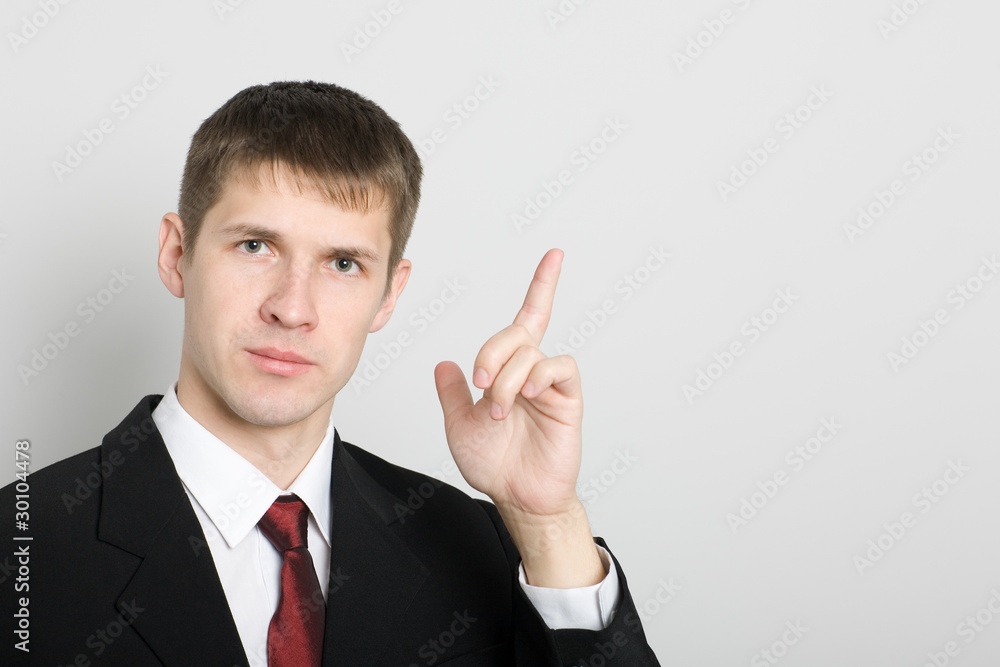 Businessman points his hand towards the. Businessman points his hand towards the.