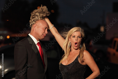 Woman revealing the bald man