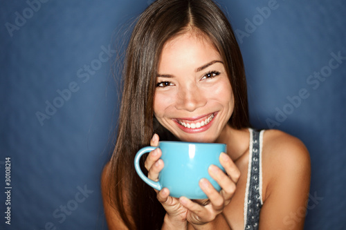 Woman smiling drinking tea