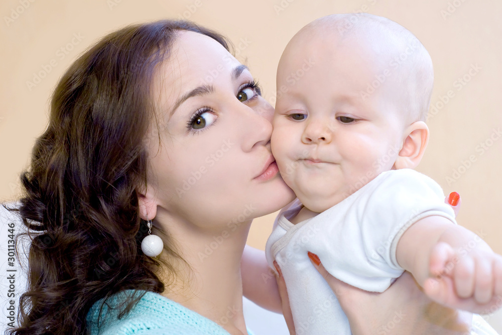 Portrait of young mum together with a small son Portrait of young mum together with a small son