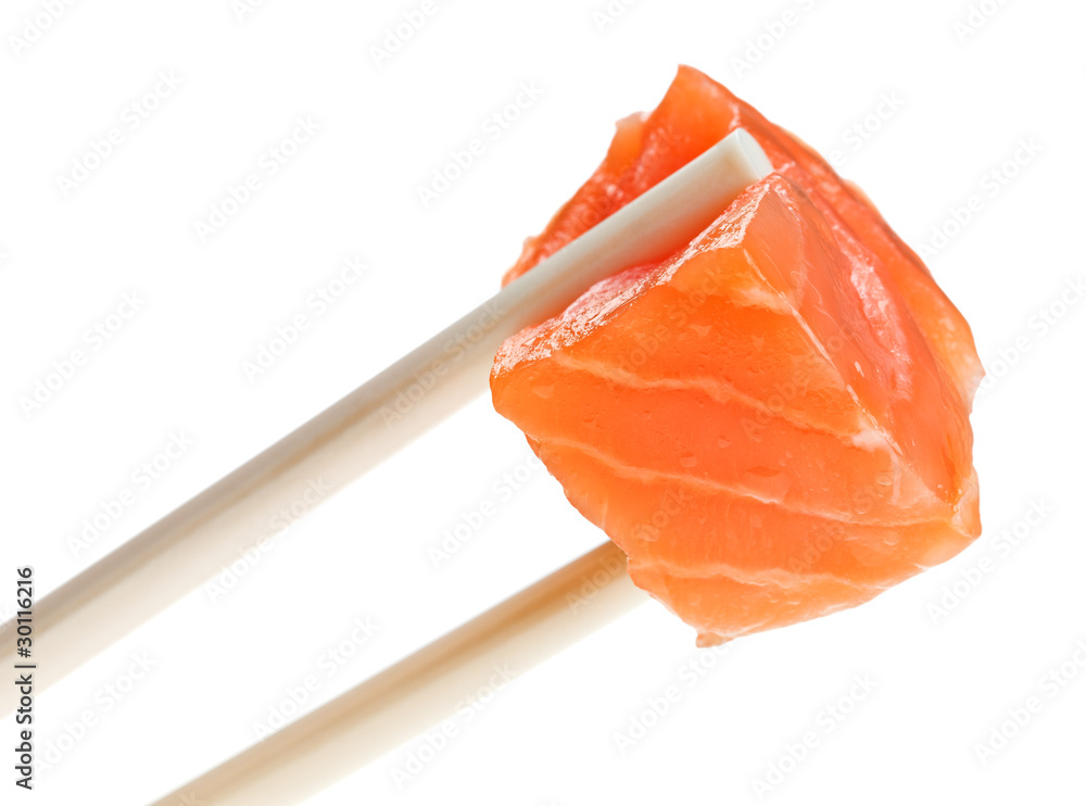 Slice of red salmon fish in chopsticks Slice of red salmon fish in chopsticks