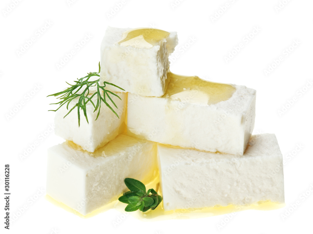 Feta cheese cubes with thyme twig and oil drops