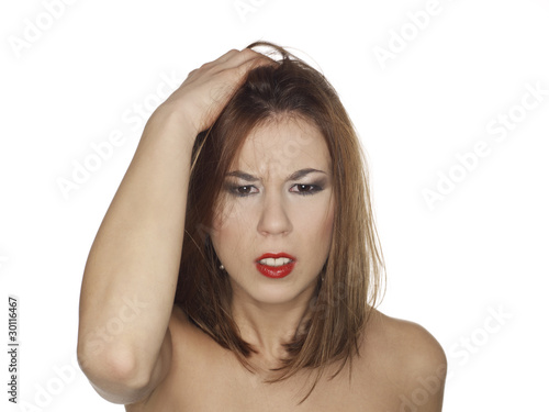 portrait of a worried young woman with bare shoulders photo