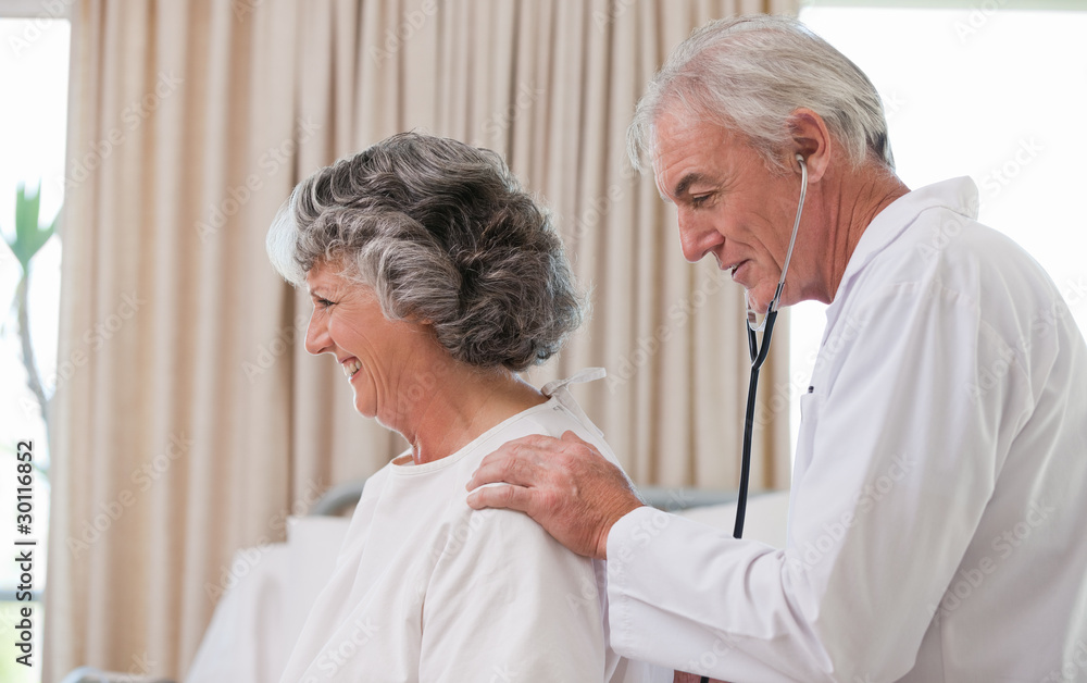 Doctor examining his patient Doctor examining his patient