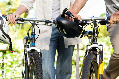 Joyful couple with their bikes