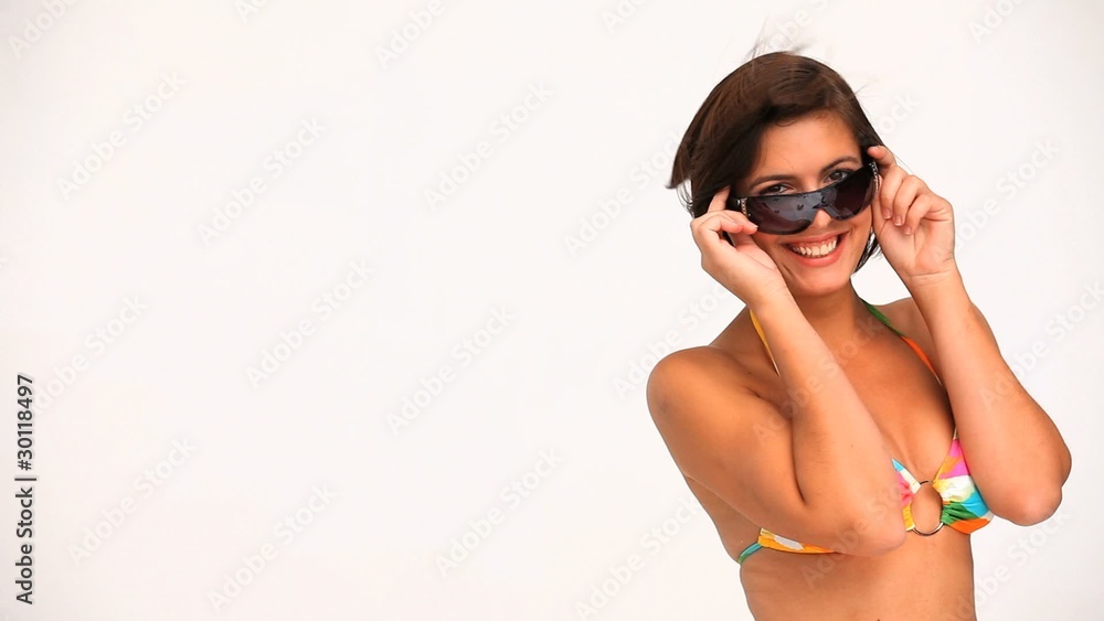 Wonderful brunette in swimsuit with sunglasses Wonderful brunette in swimsuit with sunglasses