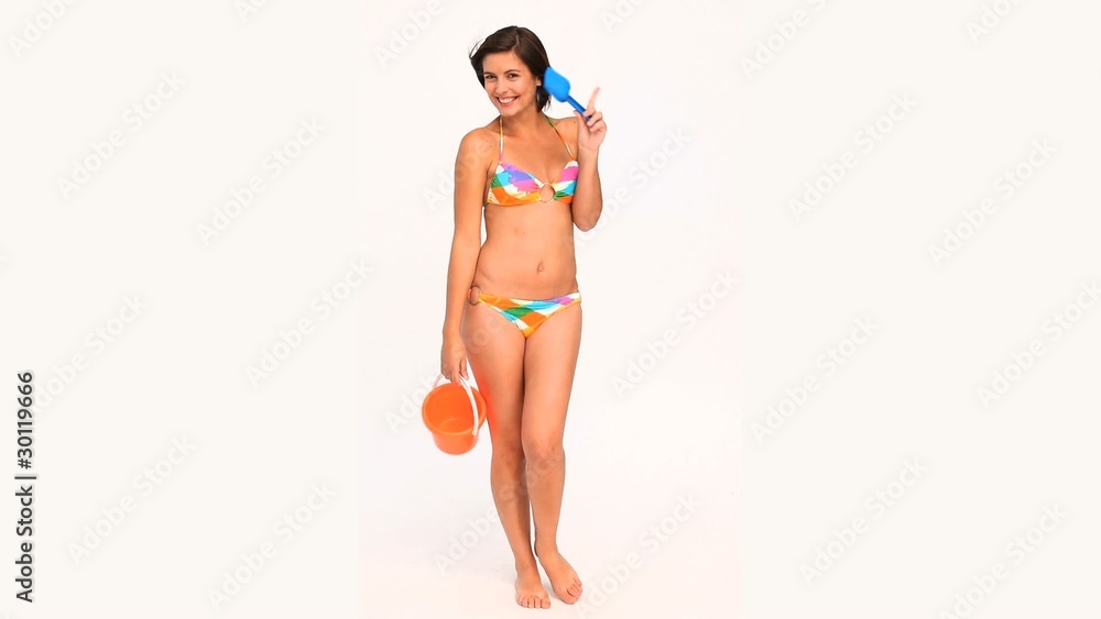 Brunette lady in swimsuit going to the beach Brunette lady in swimsuit going to the beach