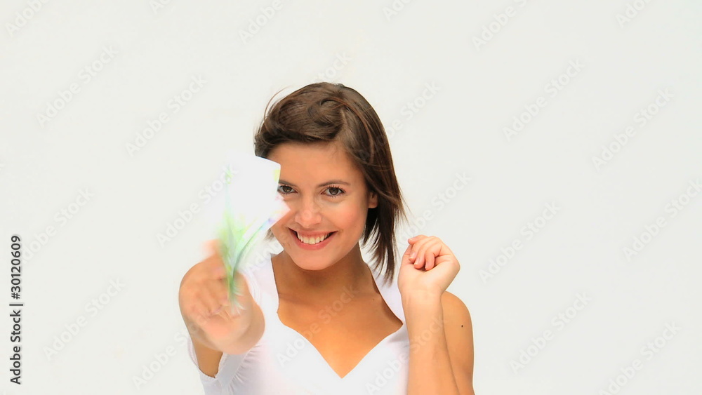 Pretty brown-haired woman counting her cash Pretty brown-haired woman counting her cash