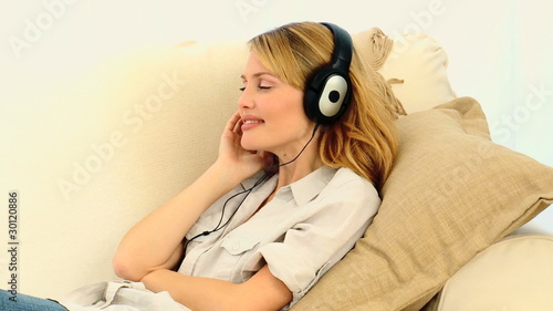 Gergeous woman listening to music photo