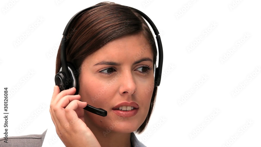Brunette woman speaking over the headset Brunette woman speaking over the headset