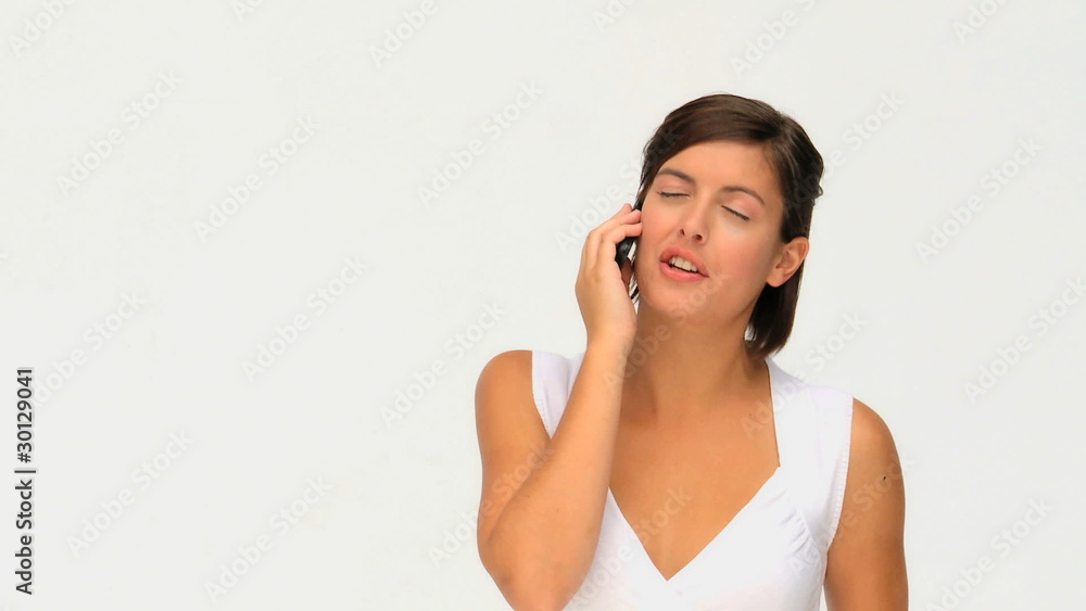 An attractive brunette beauty having a phone call An attractive brunette beauty having a phone call