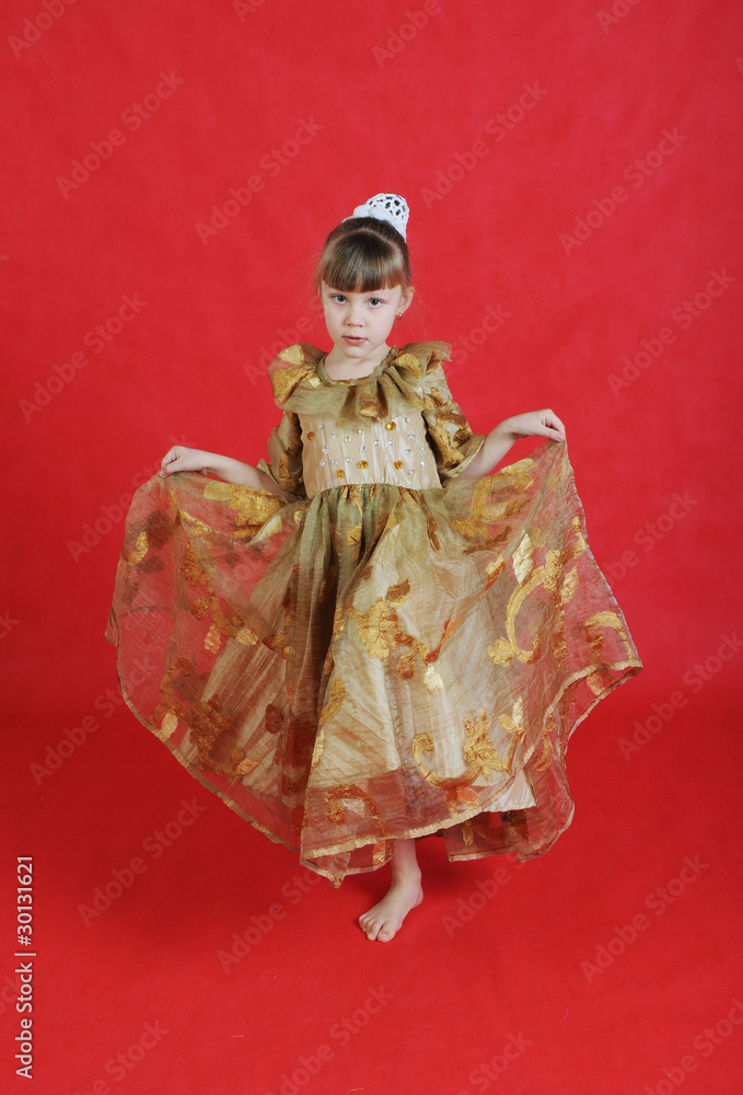 Fototapeta premium Charming little girl standing in a model pose.