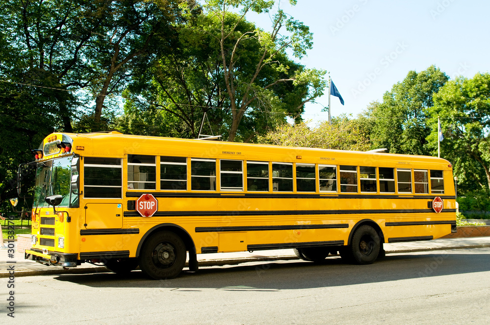 Yellow school bus on the street Yellow school bus on the street