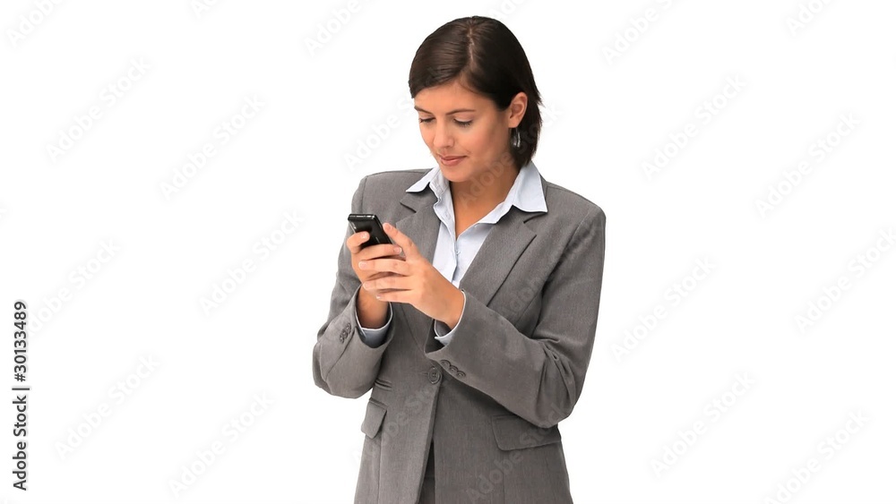 Cute businesswoman writing a text with her smartphone Cute businesswoman writing a text with her smartphone