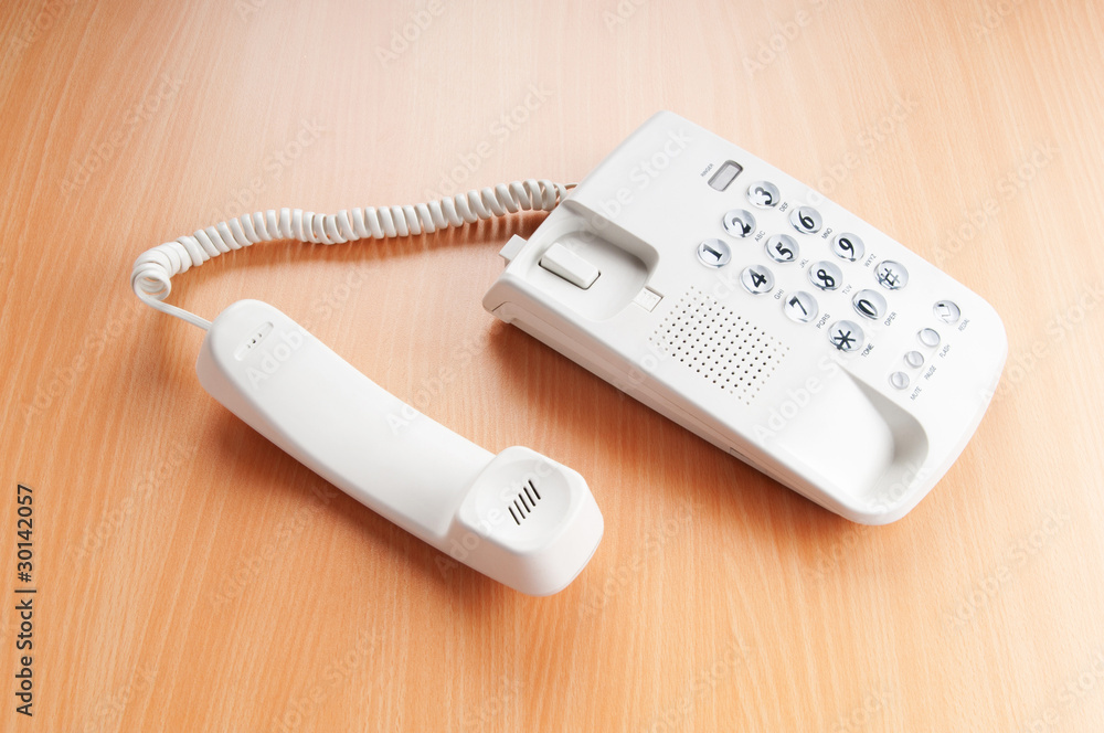 White office phone on the flat surface White office phone on the flat surface