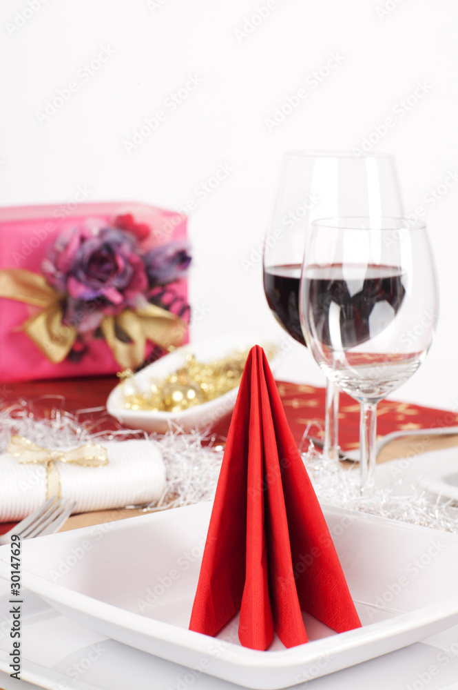 Close-up view of red napkin arranged on white plate Close-up view of red napkin arranged on white plate