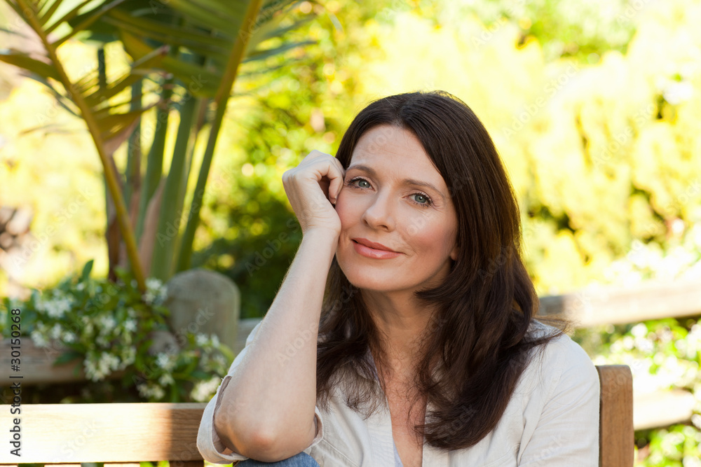 Portrait of a pretty woman in the garden Portrait of a pretty woman in the garden