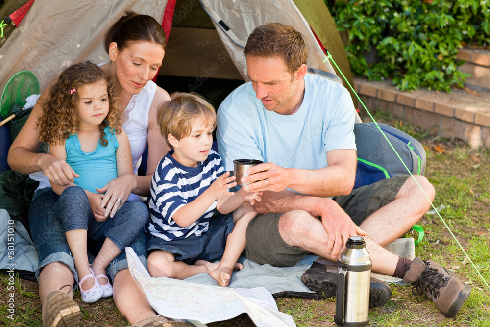 Adorable family camping in the garden Adorable family camping in the garden