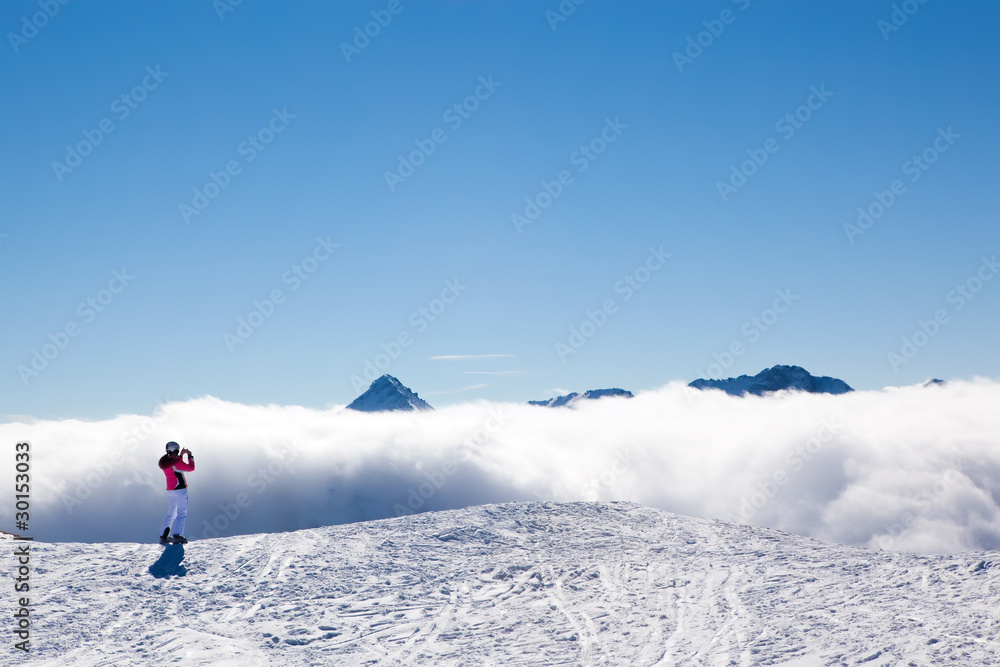 Tourist skier in mountains