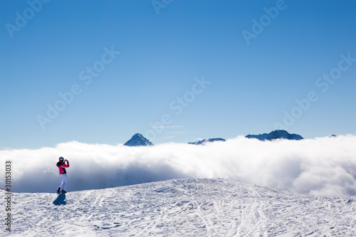 Tourist skier in mountains