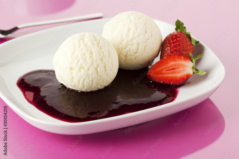 vanilla ice cream with berry sauce and strawberries vanilla ice cream with berry sauce and strawberries