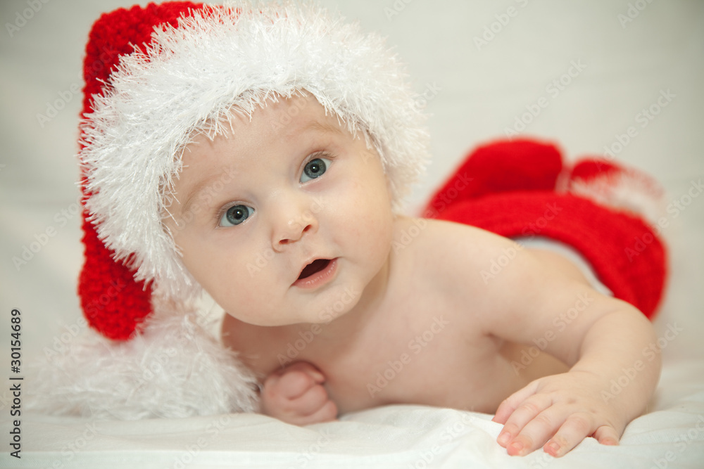 The baby in a cap of Santa The baby in a cap of Santa
